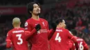 Takumi Minamino. Pemain sayap Jepang berusia 27 tahun yang telah 3 musim berseragam Liverpool ini tampil 4 kali di Carabao Cup musim 2021/2022 hingga semifinal leg pertama. Meski tidak diturunkan di laga final, sumbangan 4 gol dan 1 assistnya telah membuka jalan mulus bagi The Reds. (AFP/Paul Elis)