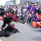 Sekitar 1000 pendekar memadati Bundaran HI untuk merayakan Lebaran Pendekar Betawi 2016, Jakarta, Minggu (7/8). Kegiatan diisi dengan sejumlah aksi pencak silat oleh beberapa pendekar. (Liputan6.com/Angga Yuniar)