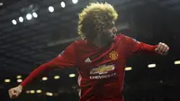 Marouane Fellaini mencetak gol pertama Manchester United (MU) ke gawang Wigan Athletic di Piala FA. (AP Photo/Rui Vieira)