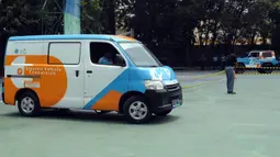 PLN Unit Induk Distribusi (UID) Jakarta Raya bersama Dinas Pendidikan DKI Jakarta melakukan peluncuran Konversi Kendaraan Listrik atau "Electric Vehicle Conversion" (Elvis) di SMK 26 Jakarta. (merdeka.com/Imam Buhori)