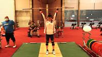 Lifter Indonesia yang akan tampil di Olimpiade Tokyo 2020, Windy Cantika. (NOC Indonesia)