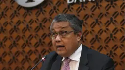 Gubernur Bank Indonesia (BI), Perry Warjiyo saat memberikan paparan hasil Rapat Dewan Gubernur (RDG) di Jakarta, Kamis (21/2). BI kembali menahan suku bunga acuan BI 7-Days Reverse Repo Rate (BI7RRR) di angka 6 persen. (Liputan6.com/Angga Yuniar)