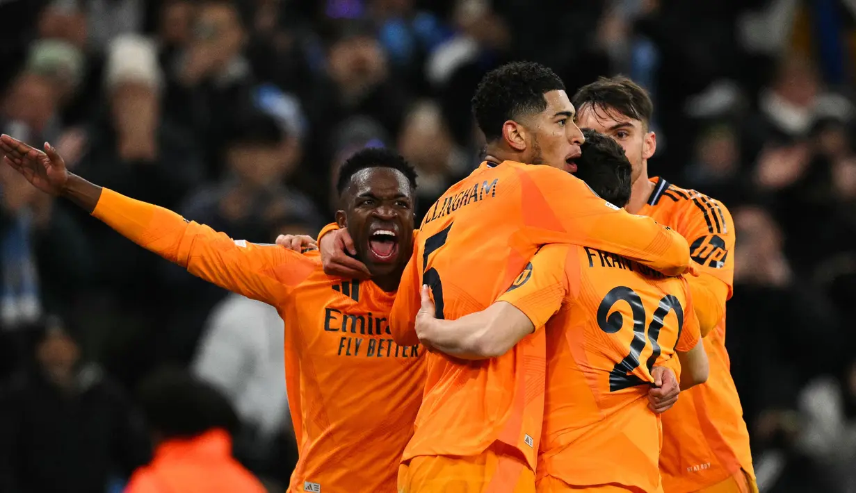 Bertandang ke markas Manchester City, Real Madrid merebut kemenangan dramatis dengan skor 3-2. (Oli SCARFF/AFP)