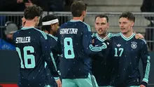 Gelandang Jerman #17, Florian Wirtz, merayakan gol ketiga timnya bersama rekan-rekan setimnya selama pertandingan persahabatan internasional antara Swiss dan Jerman di St. Jakob-Park di Basel, Swiss pada 28 Maret 2026. (Fabrice COFFRINI/AFP)