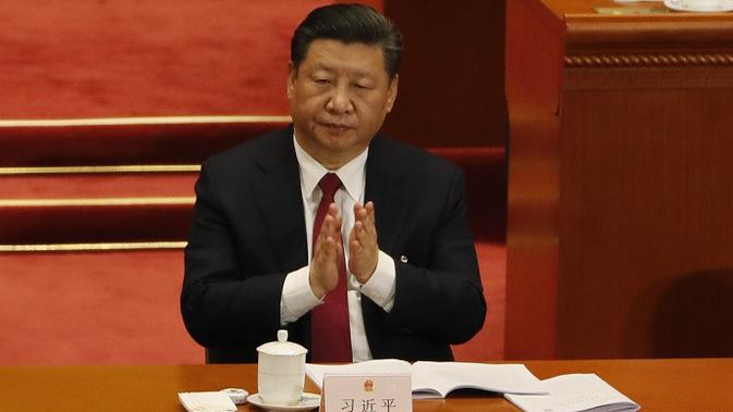 Presiden Xi Jinping saat menghadiri Kongres Rakyat Nasional yang memutuskan menyetujui penghapusan masa jabatan presiden (AP Photo/Aijaz Rahi)