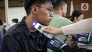 Menurut Parsadaan, kasus petugas KPPS sakit dan meninggal dunia saat bertugas pada Pemilu sebelumnya, dipengaruhi penyakit penyerta atau komorbid. (Liputan6.com/Faizal Fanani)