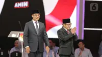 Calon Presiden dan Calon Wakil Presiden nomor urut 1 Anies Baswedan (kiri) dan Muhaimin Iskandar saat tiba untuk mengikuti Debat Kelima Pilpres 2024 di Jakarta Convention Center (JCC), Jakarta, Minggu (4/2/2024). (Liputan6.com/Angga Yuniar)