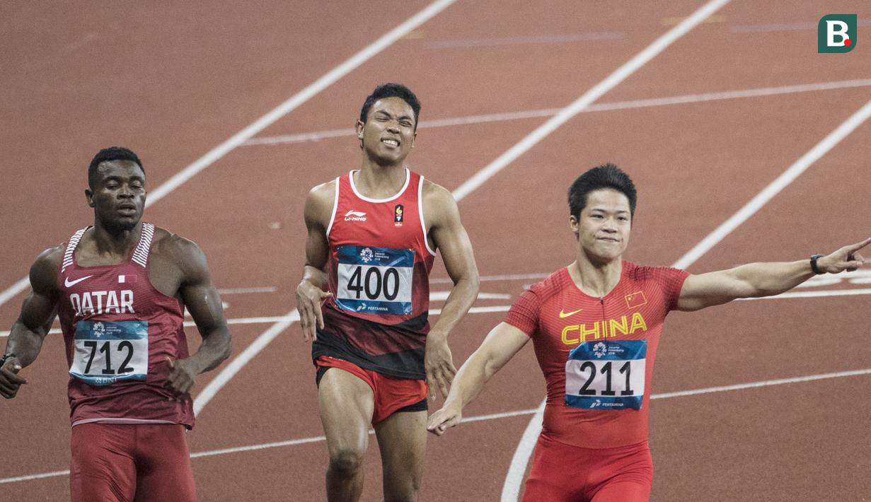 Pelari Indonesia, Lalu Muhammad Zohri, saat berlaga pada nomor 100 meter Asian Games di SUGBK, Jakarta, Minggu (26/8/2018). Lalu Zohri finish di urutan ke tujuh dengan catatan waktu 10,20 detik. (Bola.com/Vitalis Yogi Trisna)