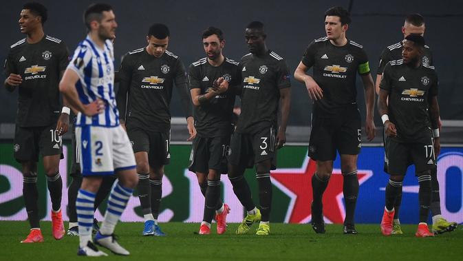 Manchester United meraih kemenangan 4-0 atas Real Sociedad pada laga leg pertama 32 besar Liga Europa di Allianz Stadium, Jumat (19/2/2021) dini hari WIB. (AFP/Marco Bertorello)