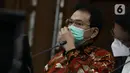 Mantan Wakil Ketua DPR Azis Syamsuddin saat mengikuti sidang lanjutan dugaan suap penanganan perkara korupsi di Lampung Tengah, Pengadilan Tipikor Jakarta, Senin (13/12/2021). Sidang bergaendakan pemeriksaan keterangan saksi-saksi. (Liputan6.com/Helmi Fithriansyah)