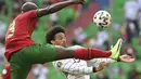 Gelandang Jerman, Leroy Sane berusaha mengontrol bola dari kawalan bek Portugal, Danilo Pereira pada pertandingan grup F Euro 2020  di Allianz Arena, Munich, Sabtu (19/6/2021). Jerman untuk sementara duduk di posisi kedua dengan poin sama seperti Portugal. (Christof Stache/Pool via AP)