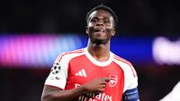Pemain Arsenal, Bukayo Saka, melakukan selebrasi setelah mencetak gol ke gawang Atletico Madrid pada laga leg kedua semifinal Liga Champions di Stadion Emirates, Rabu (6/5/2026). (John Walton/PA via AP)