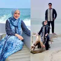 Jadi model koleksi pakaian terbaru Ivan Gunawan, Nathalie dan Frans jalani pemotretan di pantai.