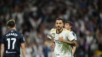 Joselu dari Real Madrid merayakan gol ke-2 timnya selama pertandingan sepak bola La Liga Spanyol antara Real Madrid dan Real Sociedad di stadion Santiago Bernab&eacute;u di Madrid, Spanyol, Minggu, 17 September 2023. (AP Photo/Jose Breton)