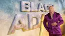 Dwayne Johnson berpose untuk fotografer saat tiba pada pemutaran perdana film 'Black Adam' di London, Inggris, 18 Oktober 2022. Dwayne Johnson atau The Rock tampil memukau saat menghadiri acara tersebut. (Photo by Vianney Le Caer/Invision/AP)