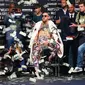 Ekspresi Conor McGregor saat dilemparkan uang petinju Floyd Mayweather saat konferensi pers tur dunia jelang pertandingannya di Barclays Center, Brooklyn, (13/7). Duel ini akan digelar di Las Vegas pada 26 Agustus. (Mike Stobe/Getty Images/AFP)