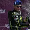Pembalap Spanyol dari tim Trackhouse MotoGP, Raul Fernandez (kiri), menyemprotkan sampanye untuk merayakan kemenangannya di podium bersama pembalap Spanyol dari tim Aprilia Racing yang menduduki posisi kedua, Jorge Martin (kanan), usai balapan MotoGP Grand Prix Inggris di Sirkuit Silverstone, Inggris tengah, pada 9 Agustus 2026. (Glyn KIRK/AFP)