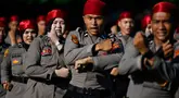 Personel Kepolisian Republik Indonesia (Polri) mengambil bagian dalam upacara memperingati Hari Bhayangkara ke-79 di Banda Aceh pada Selasa 1 Juli 2025. (CHAIDEER MAHYUDDIN/AFP)