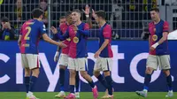 Meski kalah, skuad Hansi Flick unggul secara agregat dan berhak melaju ke ke semifinal Liga Champions 2024/2025. (Pau BARRENA/AFP)