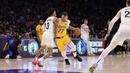 Pemain Los Angeles Lakers, Luka Doncic melakukan dribble melewati pemain Utah Jazz, Keyonte George pada laga lajutan NBA di Crypto.com Arena, Los Angeles, California pada Selasa (11/02/2025) WIB. (AP Photo/Mark J. Terrill)