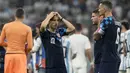 Pemain Kroasia Luka Modric, Andrej Kramaric dan Dejan Lovren, bereaksi pada akhir pertandingan babak semifinal Piala Dunia 2022 kontra Argentina di Stadion Lusail, Rabu (14/12/2022) dini hari WIB. Meskipun tersingkir, Luka Modric dkk. akan menghadapi tim yang kalah dalam duel Prancis Vs Maroko pada perebutan tempat ketiga. (AP Photo/Frank Augstein)