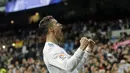 Ekspresi Cristiano Ronaldo usai membobol gawang Girona pada lanjutan La Liga Santander di Santiago Bernabeu stadium, Madrid, (18/3/2018). Gol-gol Ronaldo terjadi pada menit 11’, 47’, 64’, 90’.  (AP/Paul White)
