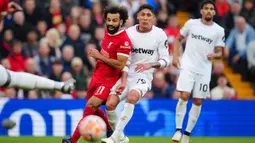 Mohamed Salah tampil bersinar bersama Liverpool pada awal musim ini. Satu golnya ke gawang West Ham United membuat penyerang asal Mesir tersebut menciptakan beberapa catatan spesial di Liga Inggris. (AP Photo/Jon Super)