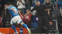 Pemain Timnas Italia, Giacomo Raspadori, merayakan golnya bersama pelatih kepala Gennaro Gattuso dalam pertandingan kualifikasi Piala Dunia antara Italia dan Estonia, Sabtu (6-9-2025) dini hari WIB, di Bergamo, Italia. (Massimo Paolone/LaPresse via AP)