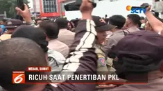 Eksekusi bangunan milik pedagang yang menutupi badan jalan berhenti akibat dihadang sejumlah mahasiswa.