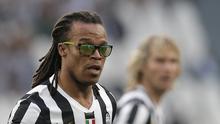 Juventus' midfielder Edgar Davids, wearing sunglasses, takes part in the Unesco Cup football match Juventus Legends vs Real Madrid Leyendas on June 2, 2014 at the Juventus Stadium in Turin. MARCO BERTORELLO / AFP