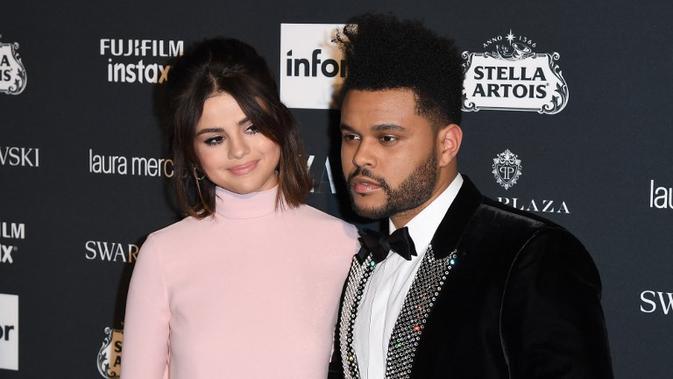The Weeknd - Selena Gomez. (Angela Weiss/AFP)