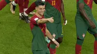 Selebrasi pemain Timnas Portugal, Cristiano Ronaldo usai menjebol gawang Ghana lewat titik penalti dalam pertandingan Grup H Piala Dunia 2022 yang berlangsung di Stadium 974, Qatar, Kamis (24/11/2022). (AP Photo/Francisco Seco)
