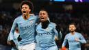 Gelandang Manchester City, Leroy Sane, bersama Gabriel Jesus, melakukan selebrasi usai membobol gawang Hoffenheim pada laga Liga Champions di Stadion Etihad, Rabu (12/12). Manchester City menang 2-1 atas Hoffenheim. (AFP/Paul Ellis)