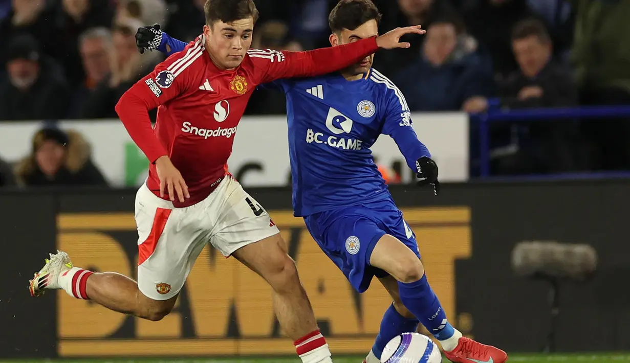 Keunggulan 1-0 untuk Manchester United bertahan hingga babak pertama usai. (Adrian Dennis/AFP)