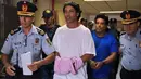 Ronaldinho pernah mendekam di penjara selama 32 hari bersama saudaranya, Roberto Assis. Mereka ditangkap oleh pihak berwajib akibat diduga menggunakan paspor palsu ketika menghadiri acara amal di Paraguay tahun 2020 silam. (Foto: AFP/Norberto Duarte)