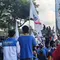 Karyawan PT Indomarco Prismatama, pengelola gerai Indomaret melontarkan protes penghapusan upah lembur ketika masuk pada libur nasional. (Foto: instagram FSPMI)