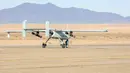 Drone lepas landas di landasan pacu selama latihan drone militer di lokasi yang dirahasiakan di Iran tengah (5/1/2021). Pengumuman latihan drone itu muncul di saat meningkatnya ketegangan antara Iran dan Amerika Serikat. (Army office/AFP)