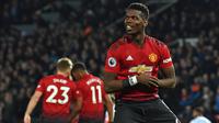 Paul Pogba. Gelandang Prancis berusia 28 tahun yang kontraknya bersama Manchester United akan berakhir pada akhir musim 2021/2022 ini menjadi top skor MU di musim 2018/2019. Ia mampu mencetak 13 gol dan 9 assist dari 35 laga di Liga Inggris.(AFP/Paul Ellis)