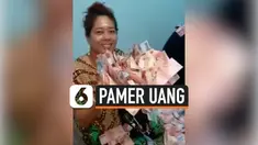 Viral di media sosial, sepasang suami istri yang memamerkan tumpukan uang di dalam kamar. Belum diketahui identitas dan lokasi ini terjadi.