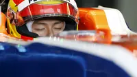 Rio Haryanto shuts his eyes as he sits in his car during the first practice session at the Australian Formula One Grand Prix in Melbourne. REUTERS/Brandon Malone