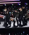 BTS tampil selama konser mereka di Gwanghwamun Square, Seoul, Korea Selatan, pada 21 Maret 2026. (KIM Min-Hee/POOL/AFP)