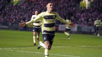 Pemain Manchester City, Phil Foden melakukan selebrasi setelah mencetak gol pertama timnya ke gawang Bristol City pada laga putaran kelima Piala FA 2022/2023 di di Ashton Gate, Rabu (1/3/2023) WIB. Foden berhasil mencetak dua gol pada laga ini, yaitu pada menit ke-7 dan ke-74. (AP Photo/Kirsty Wigglesworth)