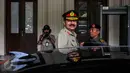 Jenderal Rashad Mahmood dari Pakistan tersenyum kepada media usai melakukan pertemuan tertutup dengan Menkopolhukam Wiranto di Kemenkopolhukam, Jakarta, Selasa (20/9). Pertemuan membahas hubungan kedua negara. (Liputan6.com/Faizal Fanani) 