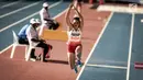 Ekspresi Atlet Lompat Jauh Indonesia, Maria Natalia Londa saat berlaga di nomor triple jump putri SEA Games di Stadium Bukit Jalil, Malaysia, Rabu (23/8). (Liputan6.com/Faizal Fanani)