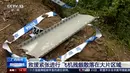 Puing-puing dikelilingi oleh pita polisi dan nomor yang ditandai di lokasi kecelakaan pesawat maskapai China Eastern Airline di Tengxian, Daerah Otonomi Guangxi Zhuang, Selasa (22/3/2022). Ada 132 orang di pesawat Boeing 737-800 itu, termasuk kru, yang jatuh pada Senin (21/3). (CCTV via AP Video)