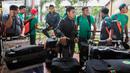 Gelandang Timnas Indonesia, Evan Dimas, bersama rekan-rekan tiba di Bandara Soekarno-Hatta, Banten, Sabtu (26/11/2016). Timnas Indonesia kembali usai bertanding pada Piala AFF 2016 di Filipina. (Bola.com/Vitalis Yogi Trisna)