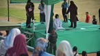 Seorang wanita dicambuk setelah ketahuan melakukan hubungan seks pranikah di sebuah stadion di Lhokseumawe di provinsi Aceh (31/7/2019). Dua pria dan seorang wanita dicambuk secara terbuka sebanyak 100 kali karena melanggar hukum Islam di daerah tersebut. (AFP Photo/Rahmad Mirza)