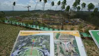 Sebuah rendering digital yang menunjukkan tata letak kompleks istana kepresidenan di ibu kota baru ditampilkan di lokasi pembangunannya di Penajam Paser Utara, Kalimantan Timur, Indonesia, Rabu, 8 Maret 2023. Deputi Bidang Sarana dan Prasarana Otorita Ibu Kota Negara (IKN) Nusantara, Silvia mengungkapkan nantinya di dalam Kawasan Inti Pusat Pemerintahan (KIPP) bisa ditemukan Sumbu Nusantara, Istana Presiden, Kantor Presiden, Kantor Kementerian/Lembaga, dan juga hunian untuk ASN. (AP Photo/Achmad Ibrahim)