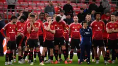 Ekspresi para pemain Manchester United atas kekalahan mereka di final Liga Europa musim 2024/2025 melawan Tottenham Hotspur di stadion San Mames, Bilbao pada 21 Mei 2025 waktu setempat atau Kamis (22/5) dini hari WIB. (Josep LAGO/AFP)
