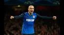 Penyerang AS Monaco, Dimitiar Berbatov merayakan selebrasi usai mencetak gol ke gawang Arsenal di laga 16 besar Liga Champions di Emirates Stadium, London, (25/2/2015). AS Monaco unggul 3-1 atas Arsenal. ( Reuters/John Sibley)